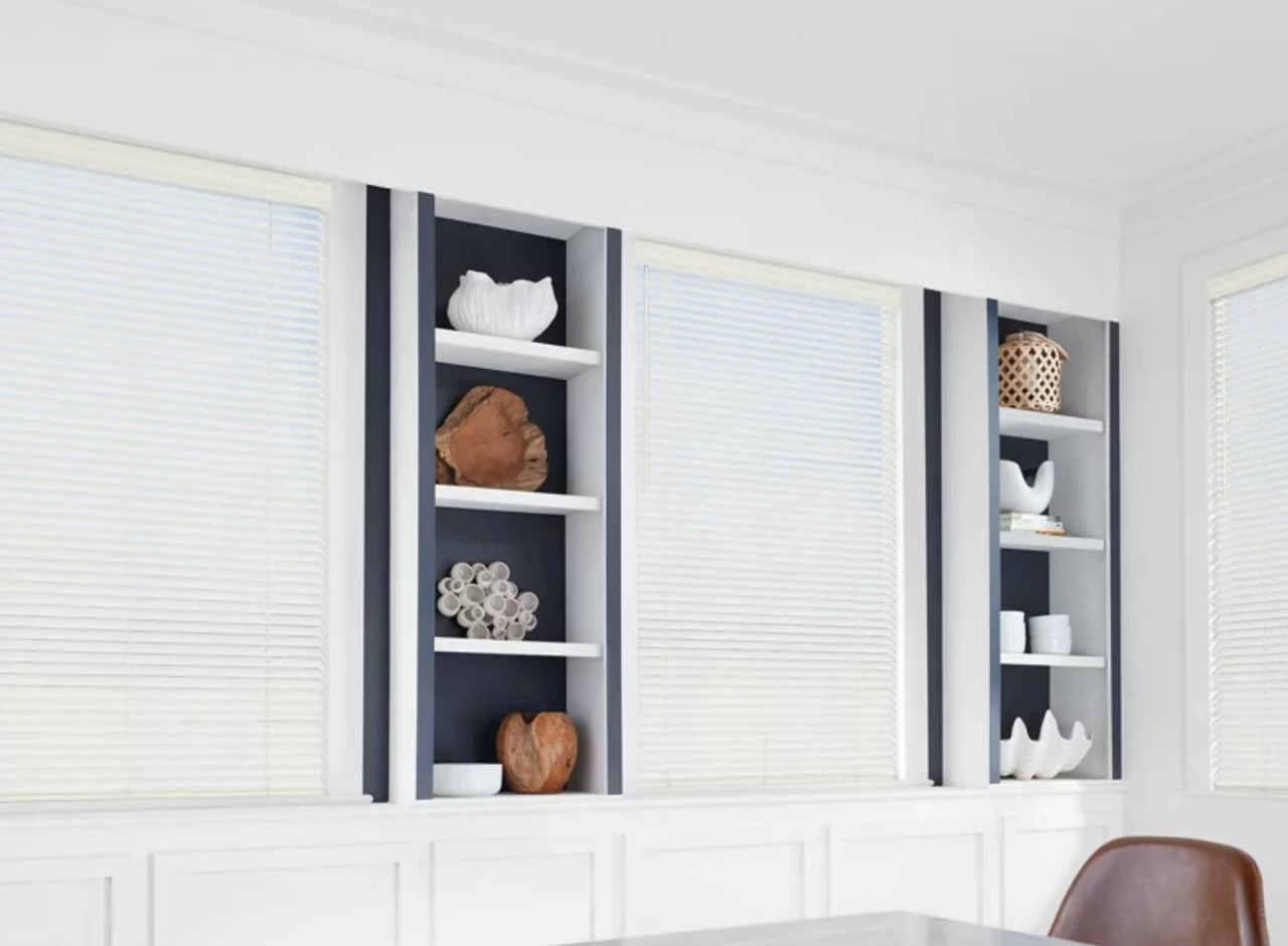 Hunter Douglas faux wood blinds covering a living room window near Kenner, LA