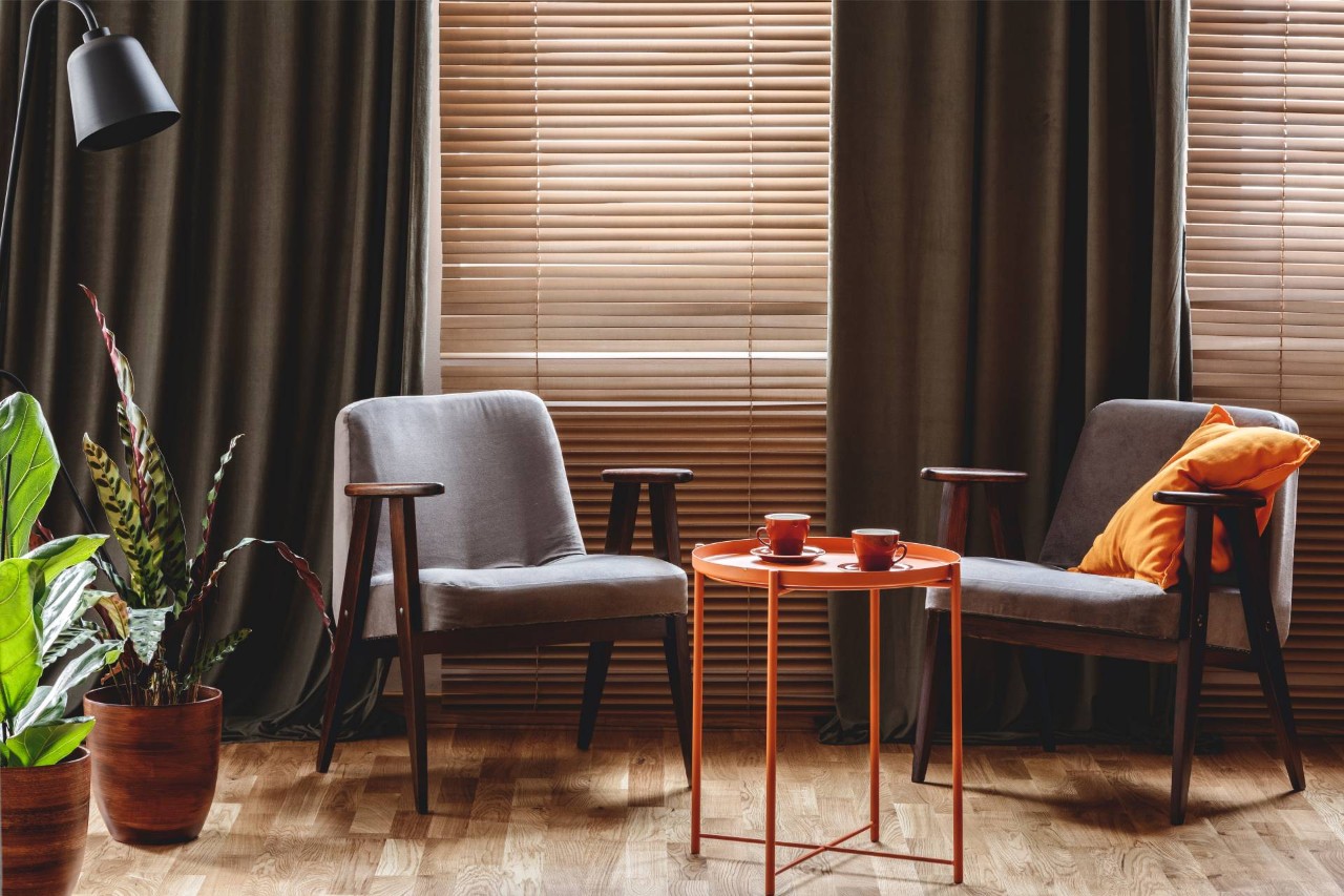 Living room with drapes and blinds near Kenner, LA